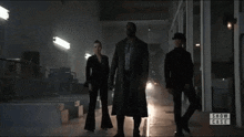 a group of people are standing in a dark room with the words show case on the bottom