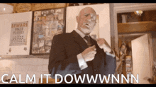 a man in a suit and tie stands in front of a sign that says beware power plates