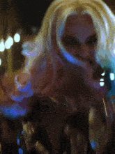 a close up of a woman with blonde hair