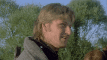 a man says " be gone " in front of a tree
