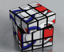 a red white and blue rubik 's cube is stacked on top of itself