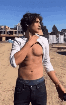 a shirtless man with calvin klein underwear on