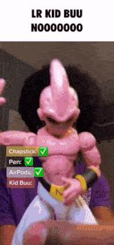 a person holding a toy that says lr kid buu no00000