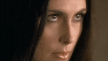 a close up of a woman 's face with her eyes closed