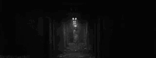 a black and white photo of a scary nurse with glowing eyes and a nurse 's hat .