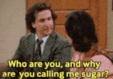 a man and a woman are sitting on a couch and the man is asking the woman " who are you "
