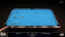 a pool table with a blue cloth and a person playing pool