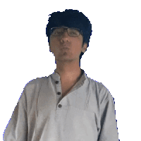 a man wearing glasses and a white shirt holds his hands to his face