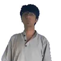 a man wearing glasses and a white shirt holds his hands to his face