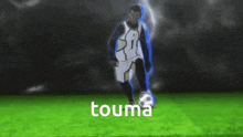 a soccer player named touma is kicking the ball