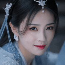 a close up of a woman wearing a tiara