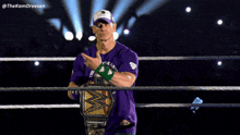 a wrestler wearing a purple shirt that says the last times now