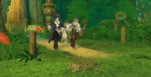 a group of people are walking down a path in the woods .