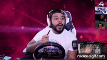 a man wearing headphones and a shirt that says ' nautica ' on it is playing a video game