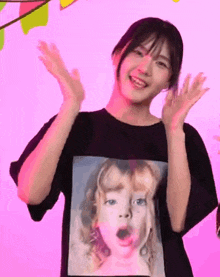 a girl wearing a black t-shirt with a picture of a girl on it