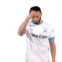 a man wearing a white shirt that says cma cg1 on it