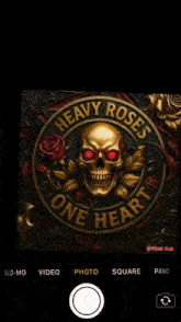 a heavy roses one heart logo with a skull and red eyes