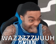 a man in a basketball jersey is making a funny face and the words wazzzzzzuuh are above him