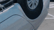 a car is upside down in a parking space