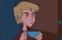 a cartoon character is holding a blue cup of tea and drinking it .