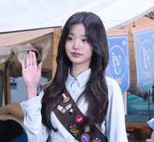a girl scout wearing a badge that says i 'v