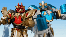 two toy robots are standing next to each other and one has a red head