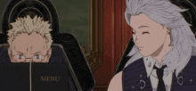 two anime characters are looking at a menu