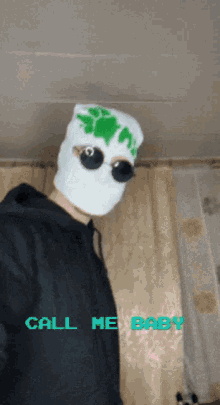 a man wearing a ski mask and sunglasses says call me baby on the bottom