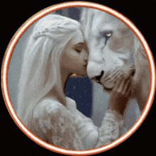 a woman in a white dress kissing a white lion on the nose