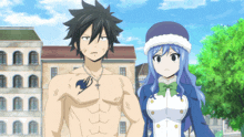a man and a woman are standing next to each other in front of a building