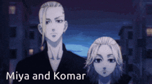 miya and komar are standing next to each other