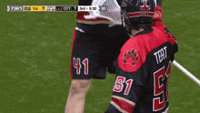 a lacrosse player wearing the number 51 jersey