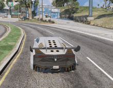 a car is driving down a road in front of a building that says auto express