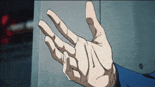 a close up of a person 's hand reaching for something