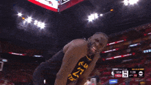 a basketball player says " it 's been real " in front of a scoreboard