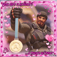 a picture of a man holding a medal with the words you are a weiner i mean winner