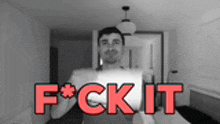 a black and white photo of a man with the words " f * ck it " in red letters