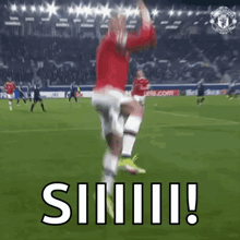 a soccer player is jumping in the air on a soccer field with the word siiiii !