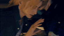 a man and a woman are touching each other 's foreheads