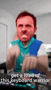 a man with an angry face is typing on a keyboard with the words get a load of this keyboard warrior below him