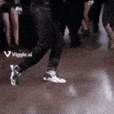 a person is dancing on a dance floor with a viggle.ai logo on the bottom