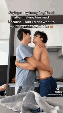 two men hugging each other in a kitchen with the caption saying sorry to my boyfriend after making him mad