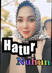 a woman wearing a hijab with the words natur nuhun on the bottom right