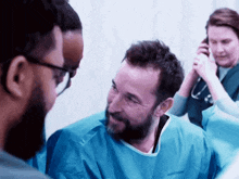 a man in a surgical gown with the word hudson on the front
