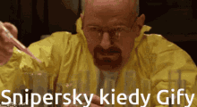 a man in a yellow jacket is holding a pipette and the words snipersky kiedy gify are below him