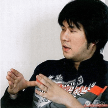 a man wearing a sweater that says society on it
