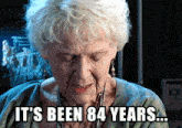 an elderly woman with the words it 's been 84 years written on her face