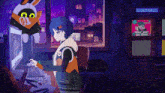 a girl is sitting at a desk in front of a computer with a stuffed animal hanging from the ceiling .