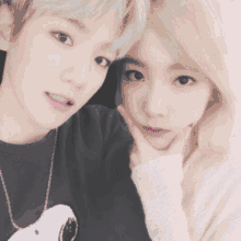 a boy and a girl are posing for a picture with the name baekyeo written on the bottom