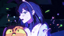a girl in a bunny ears headband holds a pumpkin